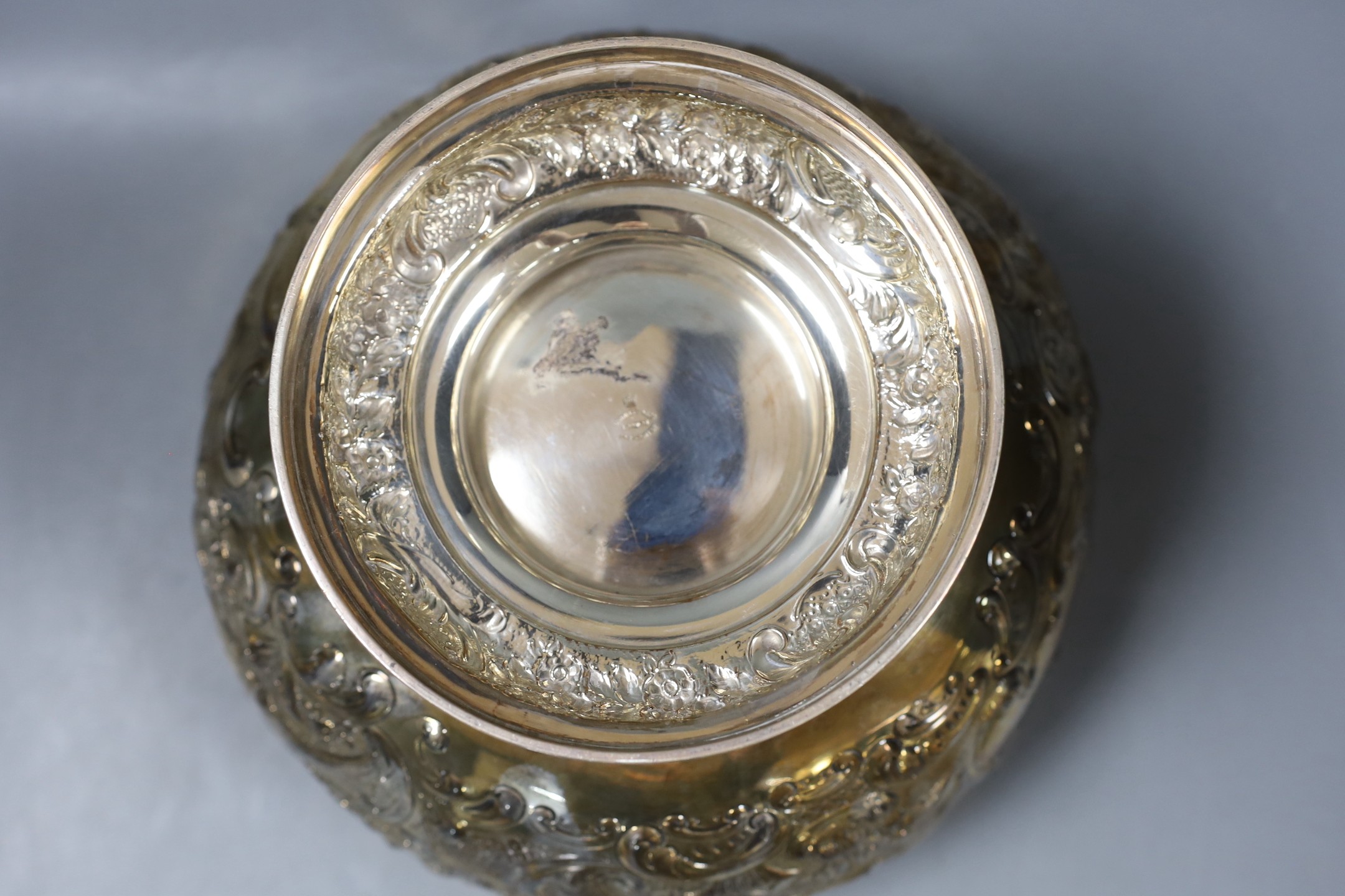 A late Victorian embossed silver rose bowl, decorated with birds amid scrolls, Carrington & Co, London, 1897, diameter, 26.5cm